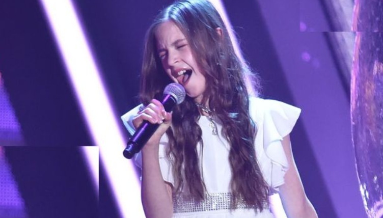 11-year-old enters the stage and announces that she will sing Elvis’ Can’t Help Falling in Love. Everyone was doubtful at first, but after she sang the first notes, the room became silent Full video is in the comment section